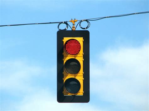 What is the fine for running a red light, and why do traffic lights sometimes feel like they're judging us?